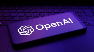 The OpenAI logo appears on the screen of a smartphone.