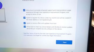 A set-up window on Acer Swift 14 AI lets you opt in or out of McAfee updates.